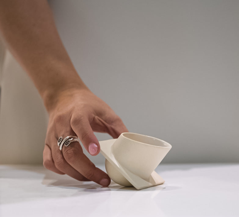 A unique and unconventional ceramic cup design’’the laying cup”